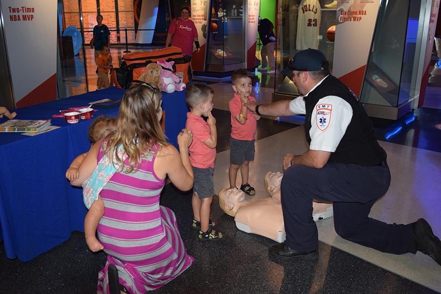 EMT with children at Kids Safety Expo