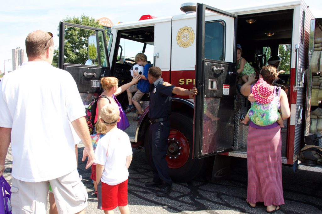 Kids in firetruck at Kids Safety Expo