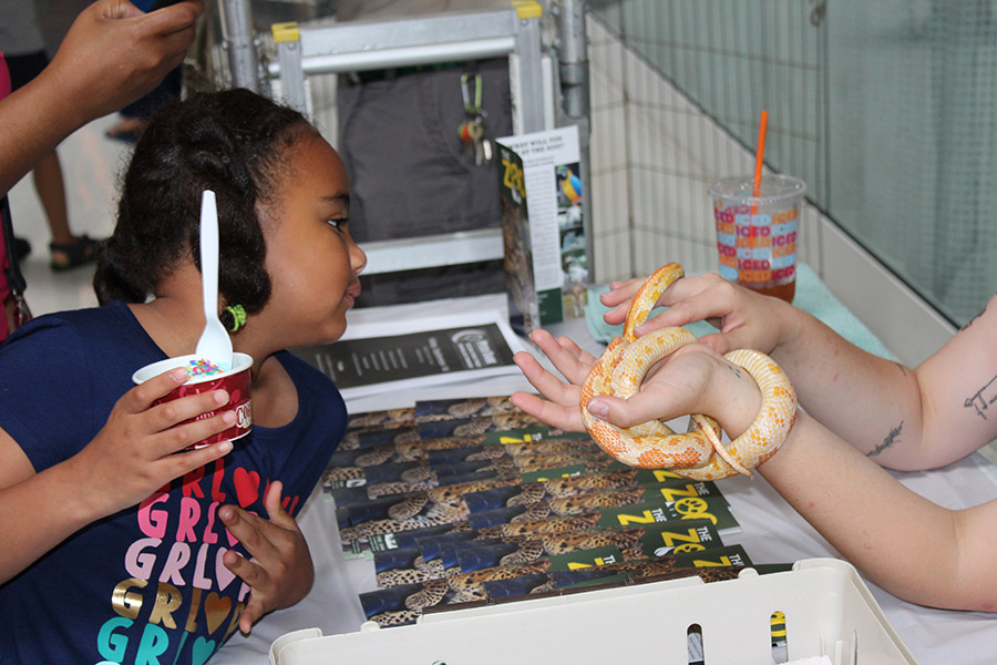 holding a snake at 2018 Kids Safety Expo