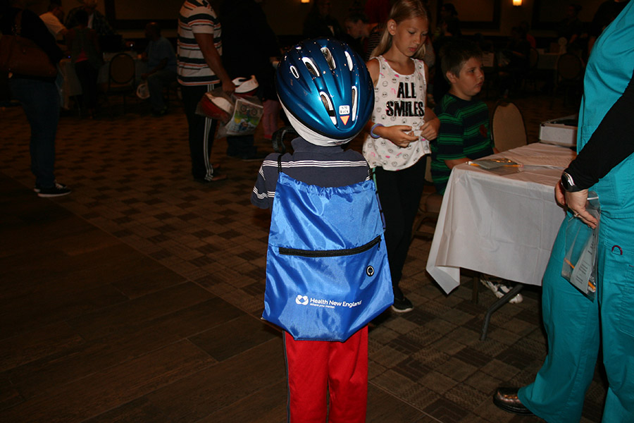 Child in bicycle helmet at Kids Safety Expo 2018