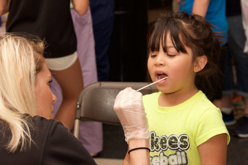 Mouth swab at Kids Safety Expo