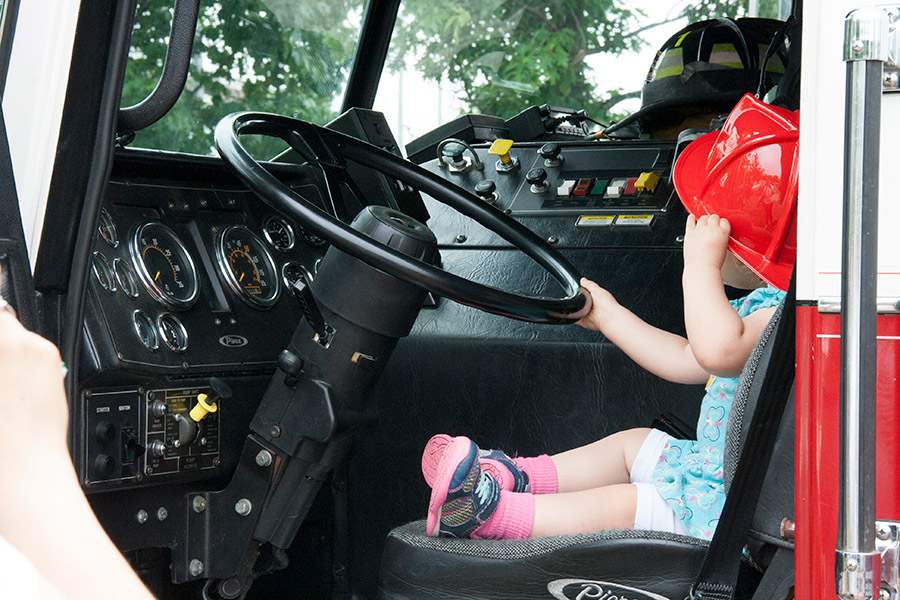 Girl in firetruck at Kids Safety Expo 2018