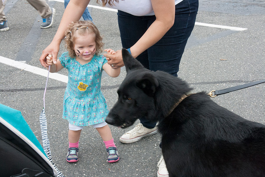 child and police dog at Kids Safety Expo 2018